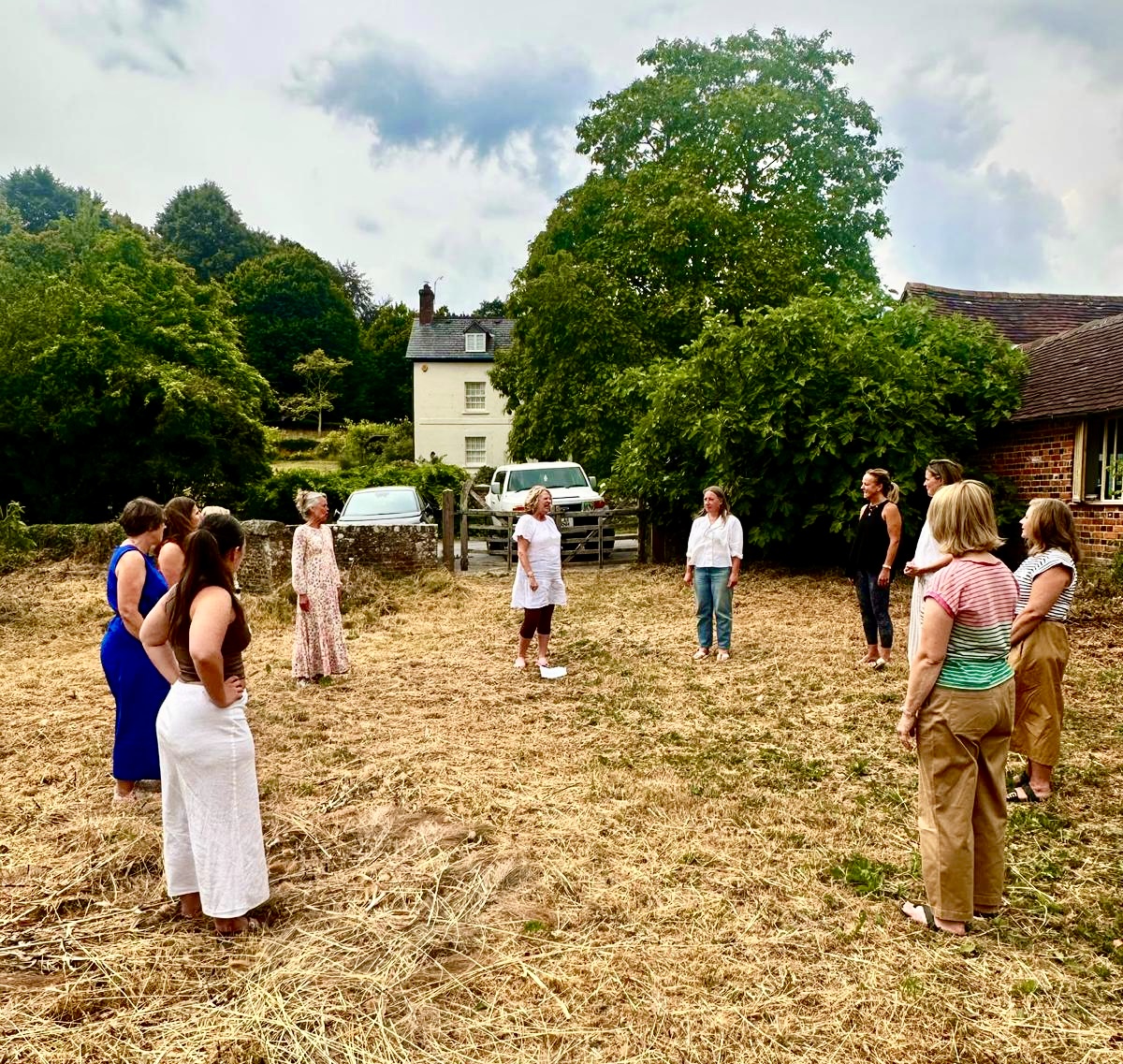 Vicky Paine facilitating a communication workshop outdoors with a group of participants