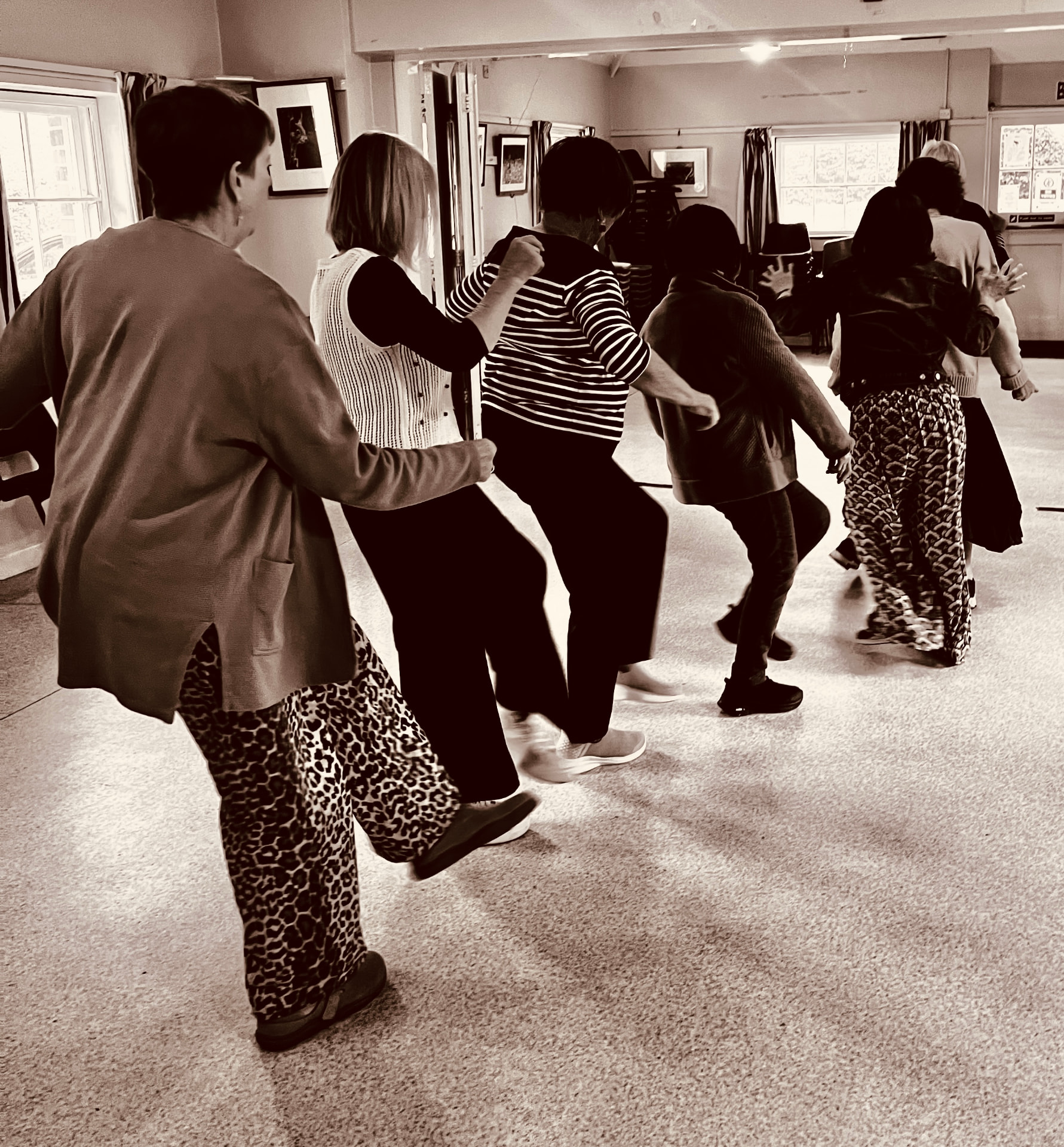 Participants engaged in a movement-based communication workshop indoors